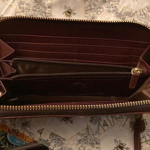 Suri Brick Charleston with a few spots visible in phots. Never carried